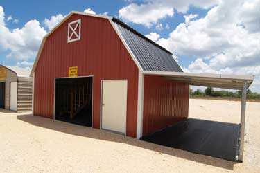 Red gambrel barn with lean-to